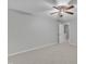 Neutral bedroom featuring plush carpet, a ceiling fan, and a doorway leading to the hallway at 220 Misty Groves Cir, Morrisville, NC 27560
