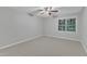 Large bedroom with window and plush carpeting at 220 Misty Groves Cir, Morrisville, NC 27560
