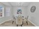 Elegant dining room with a round table, upholstered chairs, modern lighting, and tasteful decor creates a cozy setting at 220 Misty Groves Cir, Morrisville, NC 27560