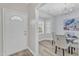 Bright dining area features a chandelier, wood flooring, and a charming bay window for delightful meals at 220 Misty Groves Cir, Morrisville, NC 27560