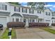Inviting exterior view of a townhome showcasing tidy landscaping and a convenient driveway, offering pleasant living space at 220 Misty Groves Cir, Morrisville, NC 27560