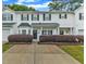 Charming townhome with a well-manicured front yard and a covered entrance, blending comfort and curb appeal at 220 Misty Groves Cir, Morrisville, NC 27560