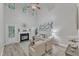 Light and bright living room featuring a fireplace, high ceilings, ceiling fan and neutral tones at 220 Misty Groves Cir, Morrisville, NC 27560