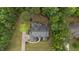 Aerial view showcases the home's manicured landscaping, spacious layout, and surrounding greenery at 2208 Wimberly Woods Dr, Sanford, NC 27330