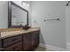 Bathroom featuring a dark vessel sink, granite countertops, and ample storage at 2208 Wimberly Woods Dr, Sanford, NC 27330