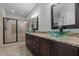 Elegant bathroom with dual vessel sinks, granite countertops, and a glass-enclosed shower at 2208 Wimberly Woods Dr, Sanford, NC 27330