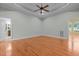 A spacious bedroom boasts hardwood floors and plenty of natural light at 2208 Wimberly Woods Dr, Sanford, NC 27330