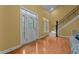 Bright foyer with stylish front door, hardwood floors, and staircase, creating an inviting first impression at 2208 Wimberly Woods Dr, Sanford, NC 27330