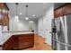 Spacious kitchen features granite counters, custom cabinetry and stainless steel appliances at 2208 Wimberly Woods Dr, Sanford, NC 27330