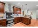 Modern kitchen featuring stainless steel appliances, granite countertops, and abundant cabinet storage at 2208 Wimberly Woods Dr, Sanford, NC 27330