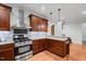 Bright kitchen featuring stainless steel appliances, modern cabinetry, granite countertops, and ample counter space at 2208 Wimberly Woods Dr, Sanford, NC 27330