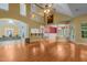 Expansive open-concept living area with hardwood floors and architectural details providing ample space for entertaining at 2208 Wimberly Woods Dr, Sanford, NC 27330