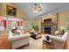 Comfortable living area with stone fireplace and stylish furniture at 2208 Wimberly Woods Dr, Sanford, NC 27330