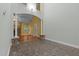 Open living space with high ceilings, stone fireplace, and archway to the dining area, offering ample space at 2208 Wimberly Woods Dr, Sanford, NC 27330