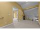 An open loft space features carpet, railings, and an entrance to another room at 2208 Wimberly Woods Dr, Sanford, NC 27330