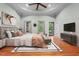 Beautiful bedroom features a decorative ceiling, hardwood floors and modern decor at 2208 Wimberly Woods Dr, Sanford, NC 27330