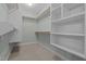 A walk-in closet features custom shelving and ample storage space at 2208 Wimberly Woods Dr, Sanford, NC 27330