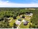 Aerial view of the estate highlighting the home, buildings, driveway, and surroundings at 2258 Sanders Rd, Stem, NC 27581