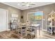 Elegant dining room with stylish furnishings, decorative accents, and a sliding door to the outdoor at 2258 Sanders Rd, Stem, NC 27581