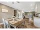 Open-concept living space with dining area featuring a lovely table setting and seamless flow to the living room at 2258 Sanders Rd, Stem, NC 27581