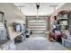 Organized two car garage with abundant storage space, white garage door, and bright lighting at 2258 Sanders Rd, Stem, NC 27581