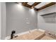 Empty laundry area with wood look floors and modern fixtures at 2258 Sanders Rd, Stem, NC 27581