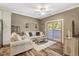 Comfortable living room featuring cozy seating, natural light, and neutral decor for a relaxing ambiance at 2258 Sanders Rd, Stem, NC 27581