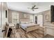 Inviting main bedroom features a ceiling fan, lots of natural light, and a walk-in closet at 2258 Sanders Rd, Stem, NC 27581