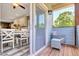 Inviting outdoor patio area with comfortable seating and sliding glass door entry at 2258 Sanders Rd, Stem, NC 27581
