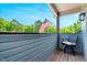 Cozy porch with an American flag, offering a relaxing outdoor space at 2258 Sanders Rd, Stem, NC 27581