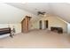 Large attic space with carpet and open area, along with an exposed brick structure at 2371 Nc 210, Smithfield, NC 27577