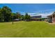 Expansive green backyard with a view of the house and covered porch at 2371 Nc 210, Smithfield, NC 27577