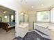 The primary bath offers a large garden tub with glass block window and a separate shower at 2371 Nc 210, Smithfield, NC 27577