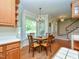 Cozy dining area with bay window and chandelier, adjacent to kitchen and staircase at 2371 Nc 210, Smithfield, NC 27577
