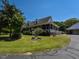 Charming home with a spacious wraparound porch, offering serene views of the lush surrounding greenery at 2371 Nc 210, Smithfield, NC 27577