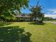 Beautiful home with a welcoming front porch and well-maintained lawn, shaded by mature trees at 2371 Nc 210, Smithfield, NC 27577