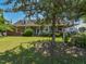 Quaint brick home featuring a covered front porch, perfect for enjoying the landscaped front yard at 2371 Nc 210, Smithfield, NC 27577