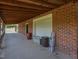 Brick house with large garage featuring a covered porch at 2371 Nc 210, Smithfield, NC 27577