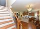 A foyer view into the kitchen showcasing oak cabinets and hardwood floors at 2371 Nc 210, Smithfield, NC 27577