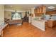 Spacious living room with fireplace, hardwood floors, and views into the kitchen at 2371 Nc 210, Smithfield, NC 27577