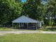 Rustic outbuilding with open sides, surrounded by green grass and gravel at 2371 Nc 210, Smithfield, NC 27577