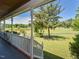 Charming front porch with white railings overlooks the well-maintained lawn at 2371 Nc 210, Smithfield, NC 27577