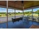 Inviting screened porch offers a peaceful retreat with swing and views of the lush backyard at 2371 Nc 210, Smithfield, NC 27577