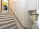 Stairwell leading to a garage with an attached door and additional storage space at 2371 Nc 210, Smithfield, NC 27577