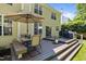 Outdoor living on multi-level deck with dining and grilling, creating the perfect space for entertaining at 2412 Colony Woods Dr, Apex, NC 27523