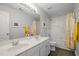Bathroom features a double sink vanity with ample counter space and a shower/tub combination at 2412 Colony Woods Dr, Apex, NC 27523