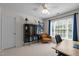 Bedroom with a desk, cabinet, and large window for an office space, with lots of natural light at 2412 Colony Woods Dr, Apex, NC 27523
