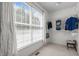 Walk-in closet with ample storage space and natural light from a large window, perfect for organizing wardrobes at 2412 Colony Woods Dr, Apex, NC 27523