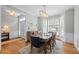 Dining room with hardwood floors, bay window, and decorative table setting at 2412 Colony Woods Dr, Apex, NC 27523