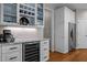 Kitchen features wine fridge, stainless steel fridge, and granite counter at 2412 Colony Woods Dr, Apex, NC 27523